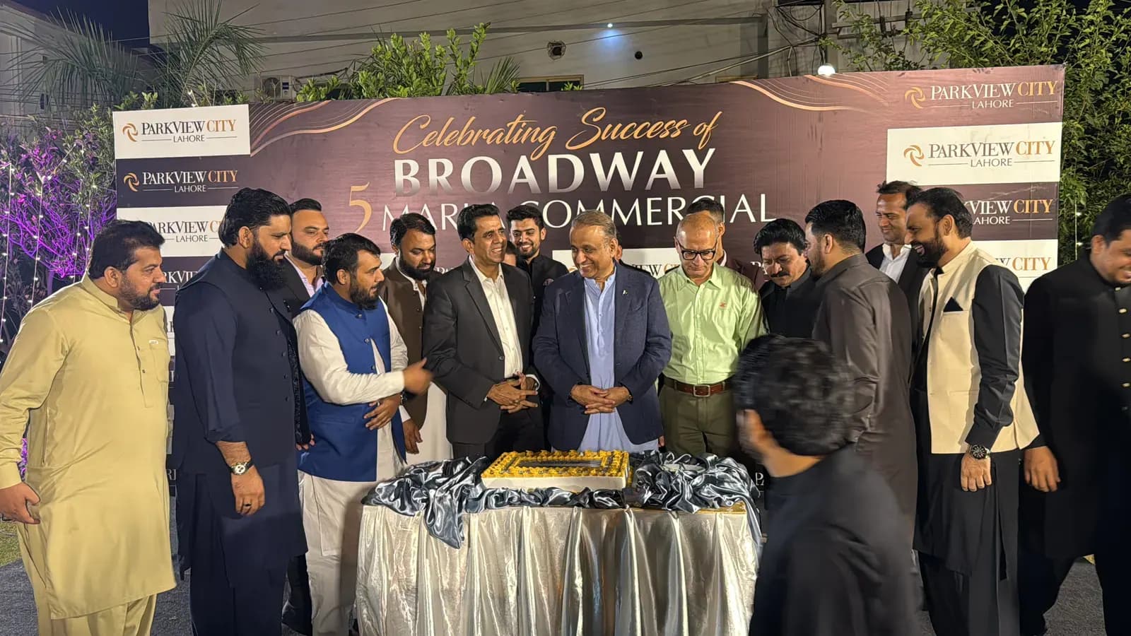 Wide-angle of the Broadway 5 Marla Commercial launch cake ceremony.