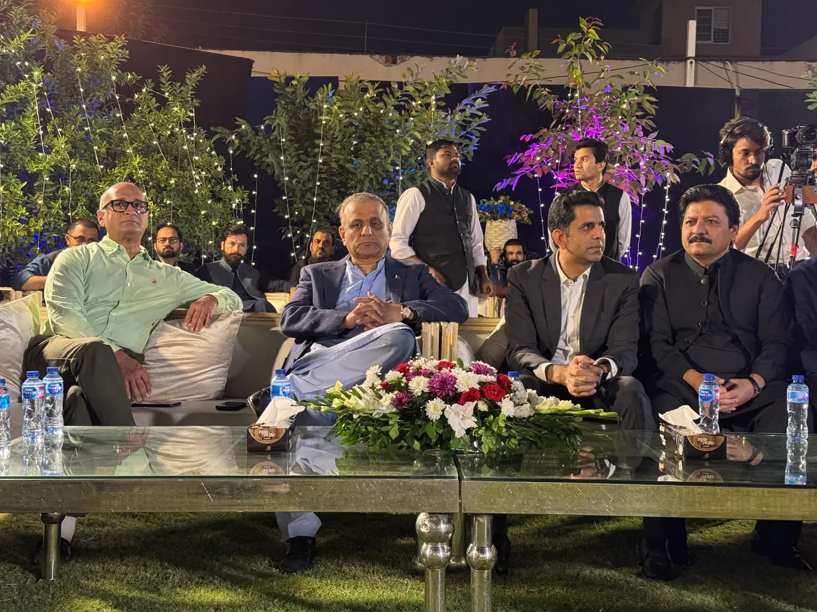 Seated audience at an outdoor PropertyInn event.