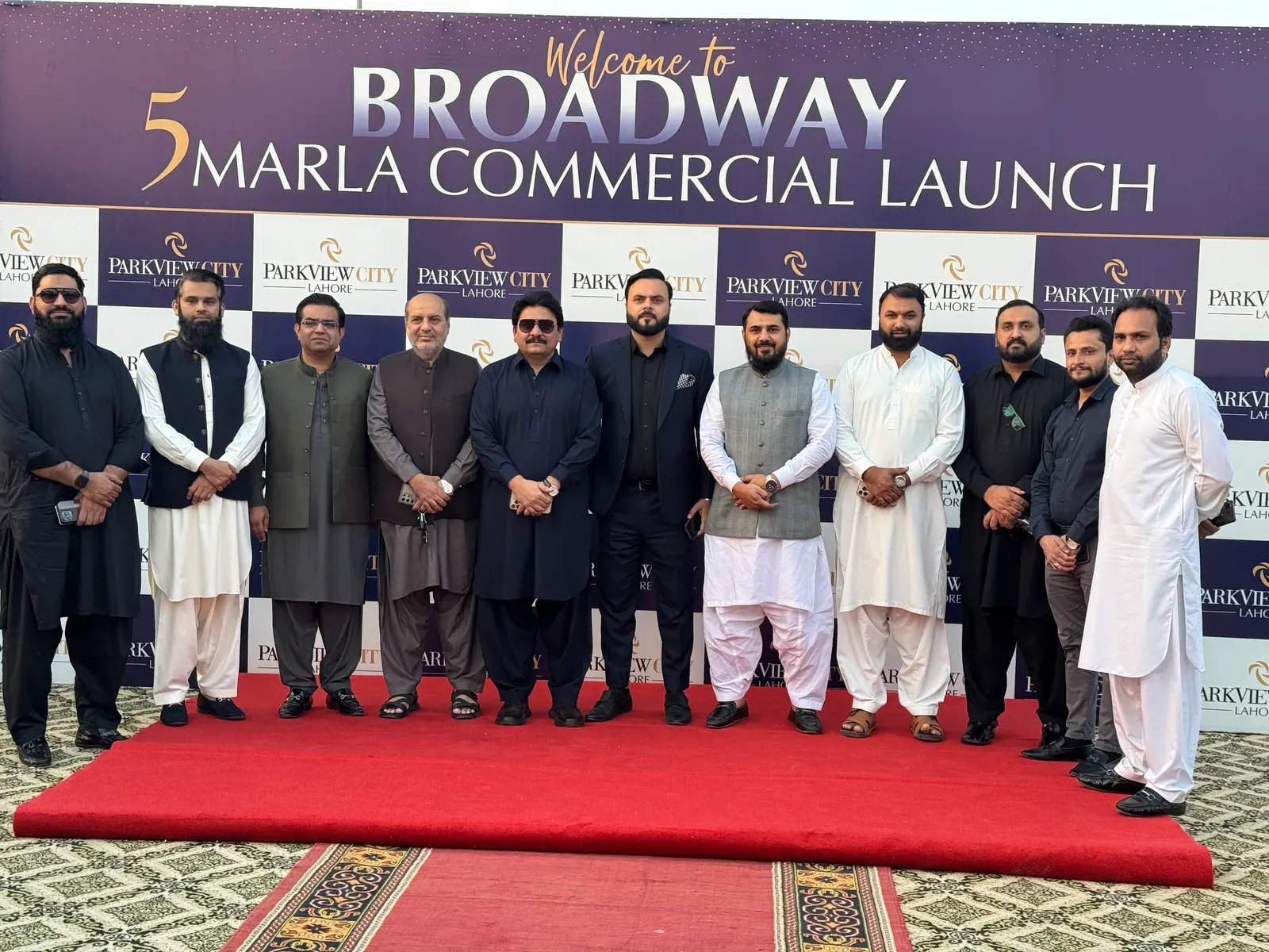 Group portrait on the red carpet at the Broadway 5 Marla Commercial launch.